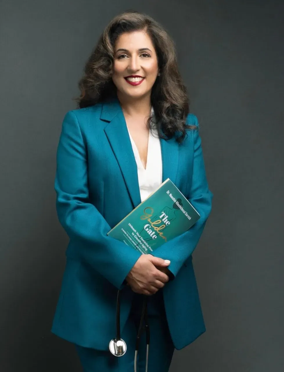 Dr. Nooshin K. Darvish holding her book The Golden Gate
